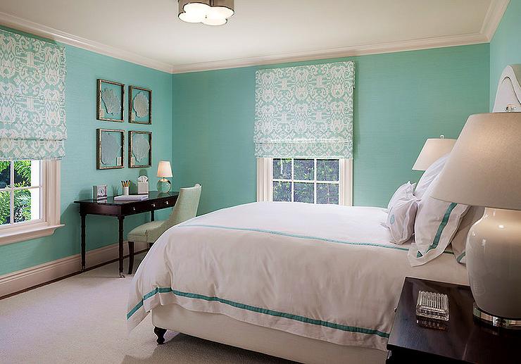 tiffany's touch of class tiffany blue lined with a white upholstered bed 